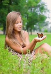 Young girl participating in a Maine buttefly release.