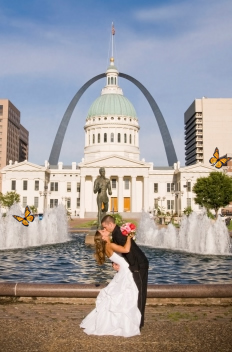A beautiful Summer butterfly release photo shoot in Missouri. A Wedding kiss in front of the St. Louis Archway.